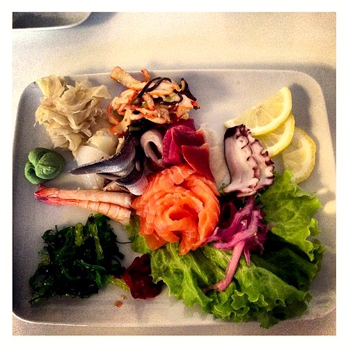 Sashimi presented with beautiful form and garnish