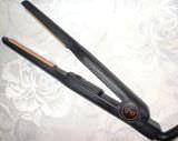 Straightening iron or straightener: Hair iron used for straightening wavy or curly hair