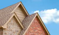 A house with shingles on the roof.