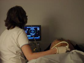 Ultrasonography being performed to check the fetal movement