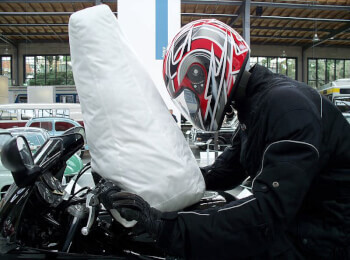 An Airbag on a motorcycle. Airbags are deployed as a result of rapid negative acceleration in a vehicle.